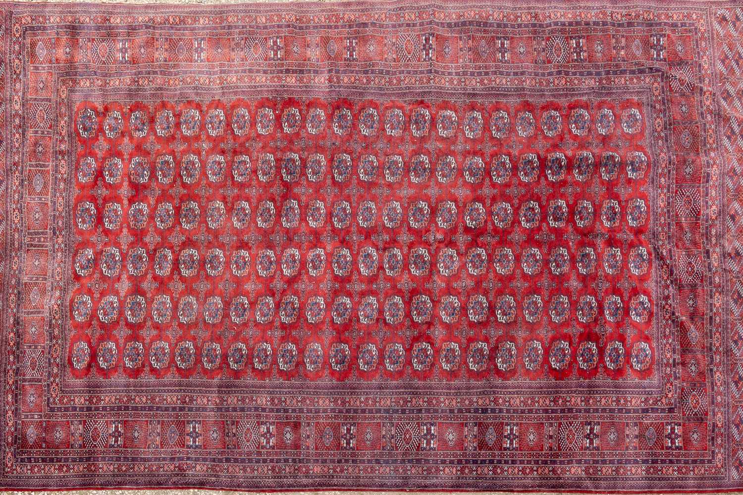 A Baluchi style red ground carpet