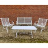 A set of white painted wrought iron French style garden furniture