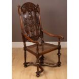 A 17th century style walnut open armchair