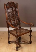 A 17th century style walnut open armchair