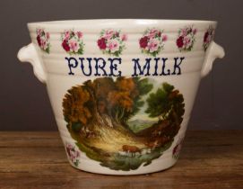 A two-handled pottery milk pail