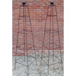 A pair of prism garden obelisks