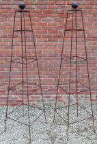 A pair of prism garden obelisks