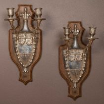 A pair of plate wall sconces