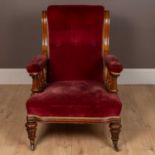 A oak framed Howard style Victorian armchair