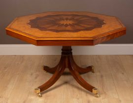 A Thos Bretton burr walnut octagonal library