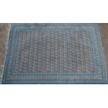 A blue ground Qum style rug