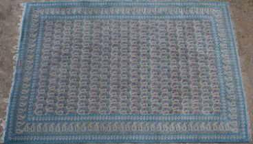 A blue ground Qum style rug