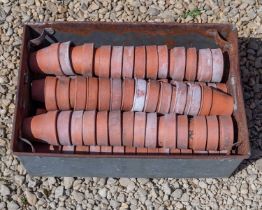 A collection of old terracotta flower pots