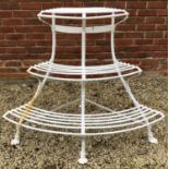 A white painted wrought iron corner auricular theatre or plant stand