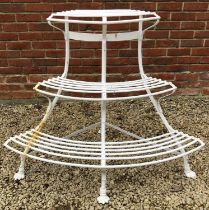A white painted wrought iron corner auricular theatre or plant stand