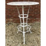 A white painted wrought iron tall table