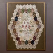 An antique silk patchwork quilt section