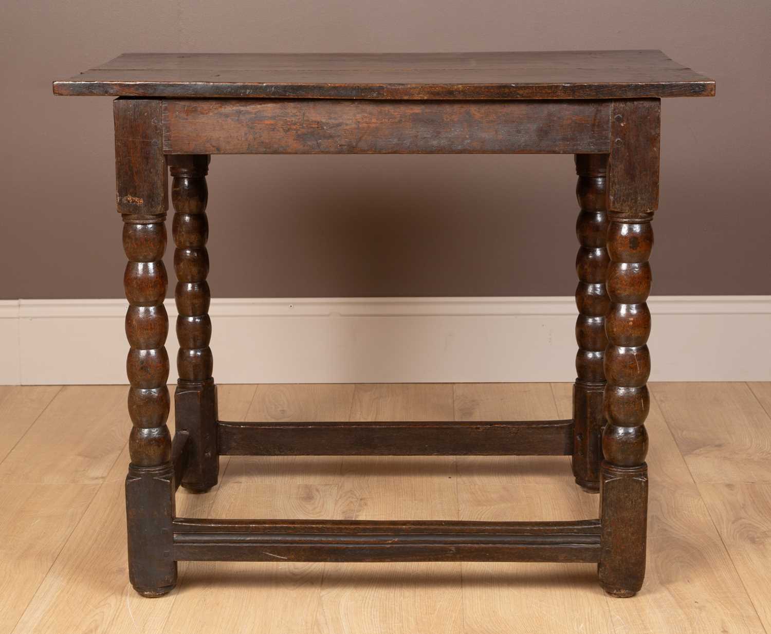 A 17th or 18th century oak centre table