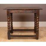 A 17th or 18th century oak centre table