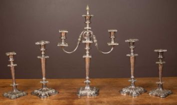 A five-piece Sheffield silver plate garniture set and a three-stick candelabrum