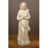 A carved marble statue of the Madonna