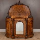 A Victorian walnut credenza with a shaped backboard