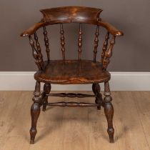 An antique ash and elm captain's Windsor armchair