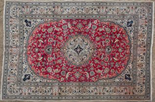 A red ground Oriental rug