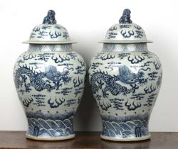 A pair of Chinese blue and white vases and covers