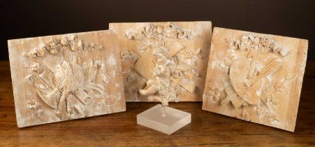 Three carved panels and a cherub