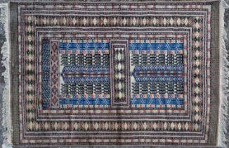 A modern machine made Afghan style prayer rug