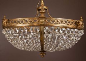 A 20th century brass-cast lustre drop-glass bag chandelier