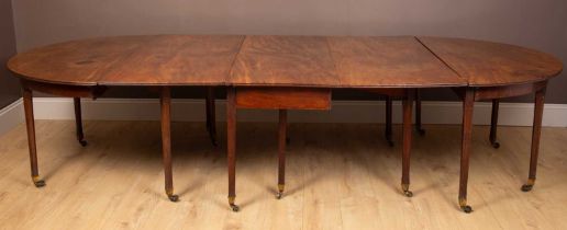 A George III extending D-end dining table