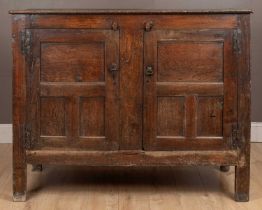 An 18th century and later oak panelled Welsh housekeeper's cupboard