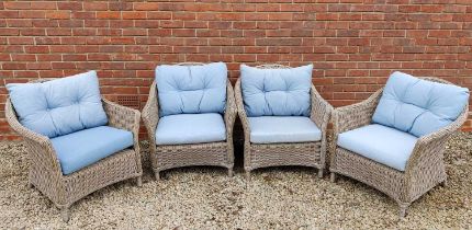 A set of four Lloyd Loom style wicker armchairs