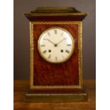 A 19th century mantel clock in plum pudding mahogany with gilt ormolu mounts