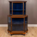 A two-tier satinwood and ebony banded glazed display cabinet