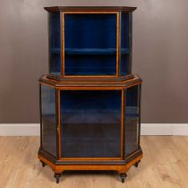 A two-tier satinwood and ebony banded glazed display cabinet