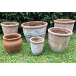 A group of six various terracotta flowerpots