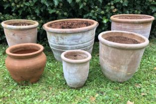 A group of six various terracotta flowerpots