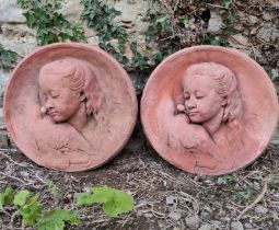 Two terracotta roundels