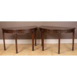 A pair of mahogany Georgian style console tables