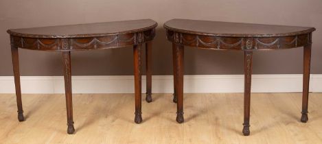 A pair of mahogany Georgian style console tables