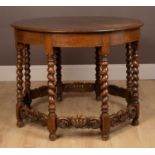 A circular oak centre table in the Jacobean style