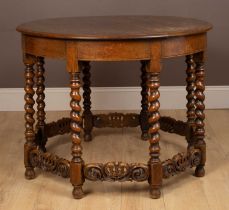 A circular oak centre table in the Jacobean style