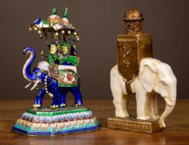 A perfume bottle modelled as an African elephant; together with an enamelled metal elephant