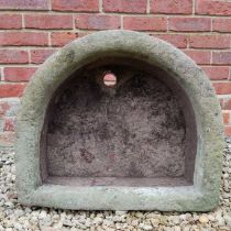 An old D-shaped stone trough