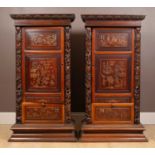 A pair of 20th-century Chinese hardwood panel inset pedestal cupboards