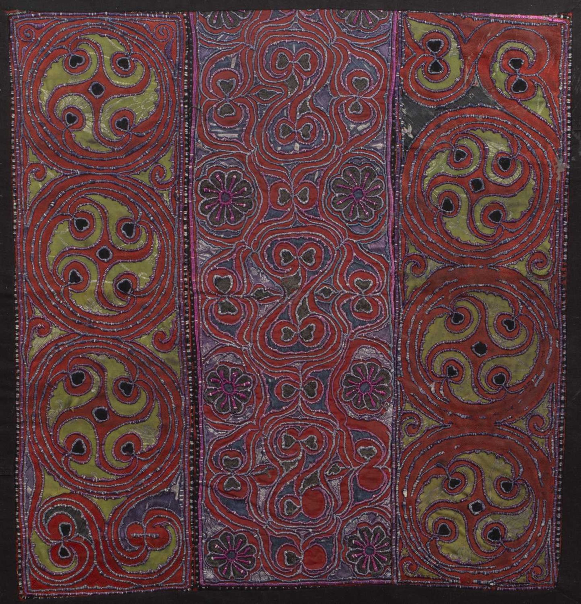 Two hill tribe red ground panels Vietnam/Cambodia with embroidered circular and other abstract