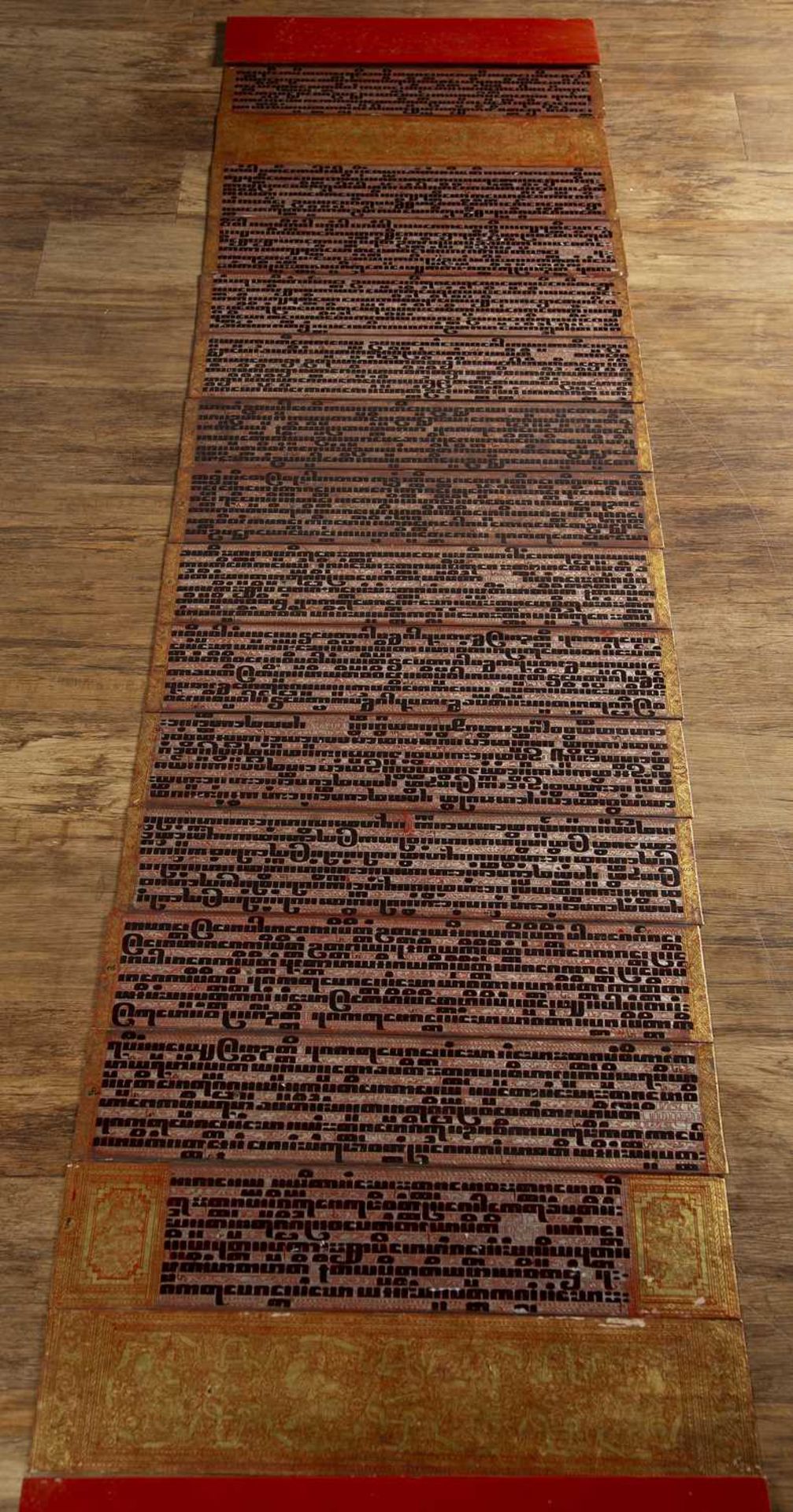Tipitaka (Kammavaca) Burmese with red and gold lacquer end boards, and sixteen panels of text, - Image 2 of 3