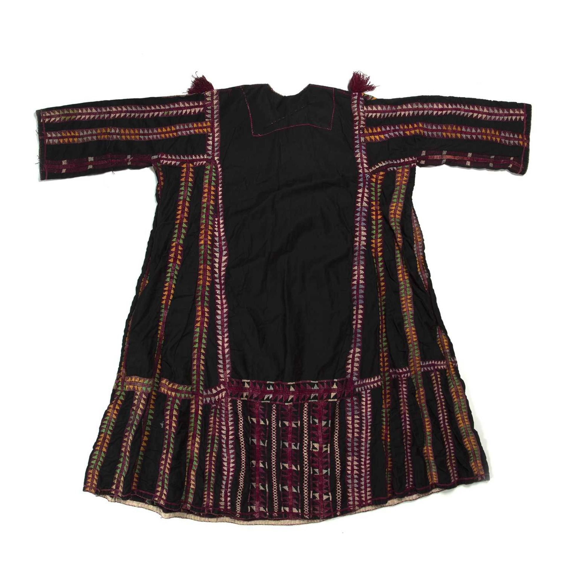 Black ground dress Palestinian with geometric embroidered borders in yellow, green and purple, - Image 2 of 2