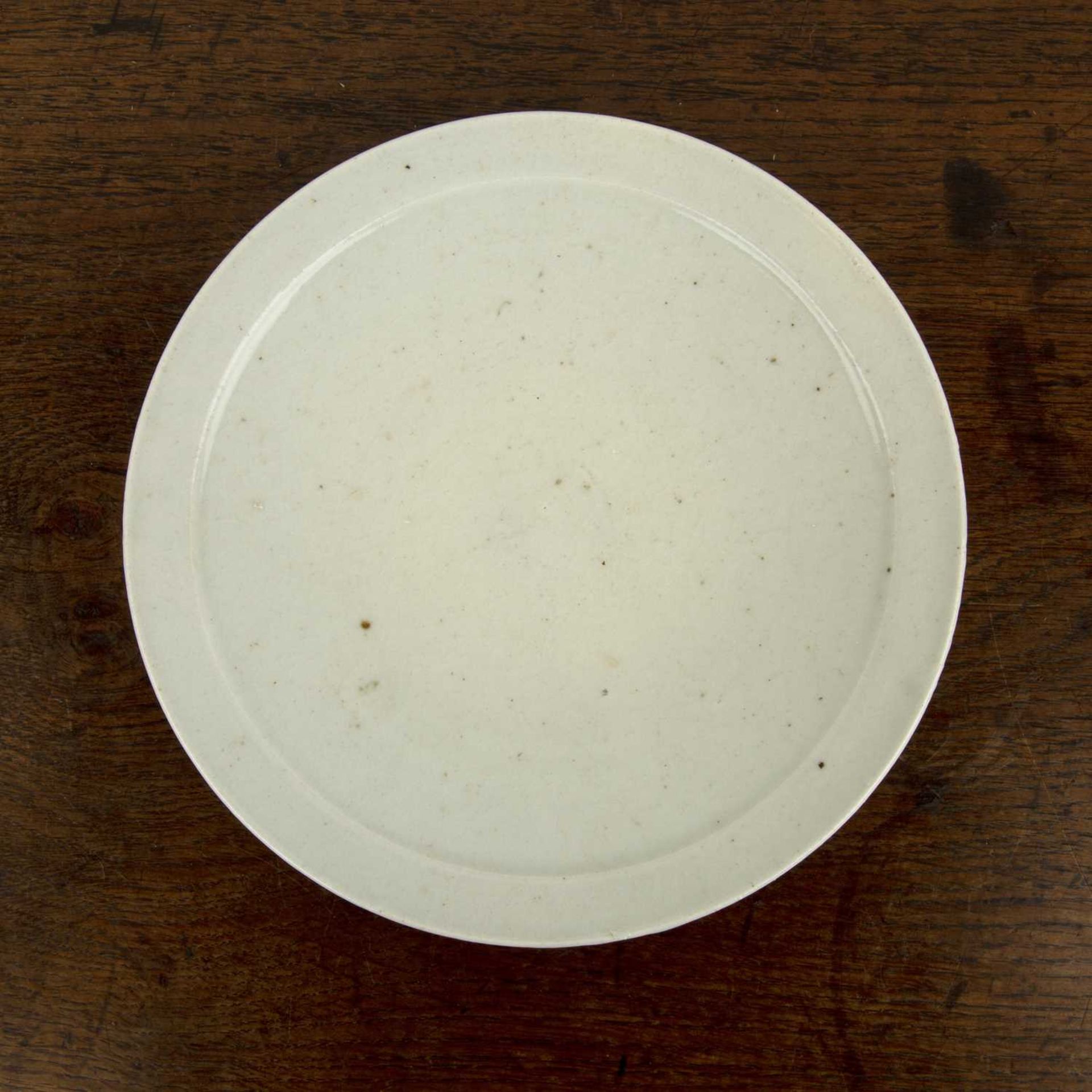 White glaze dish Korean, 16th Century finished with a raised rim, 19cm diameterCrazing to the glaze,