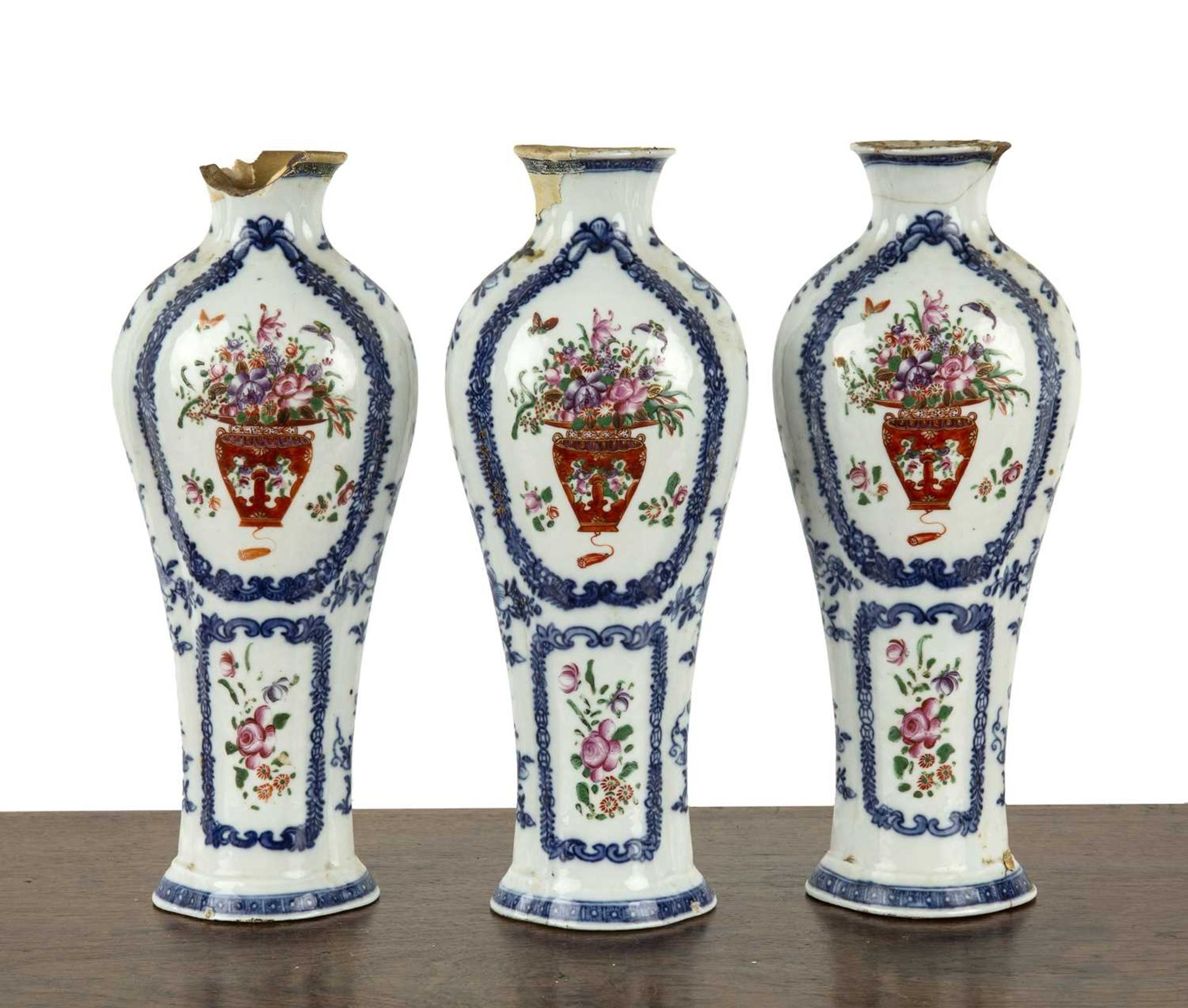 Three piece garniture of famille rose vases Chinese, late 18th Century painted with vases of