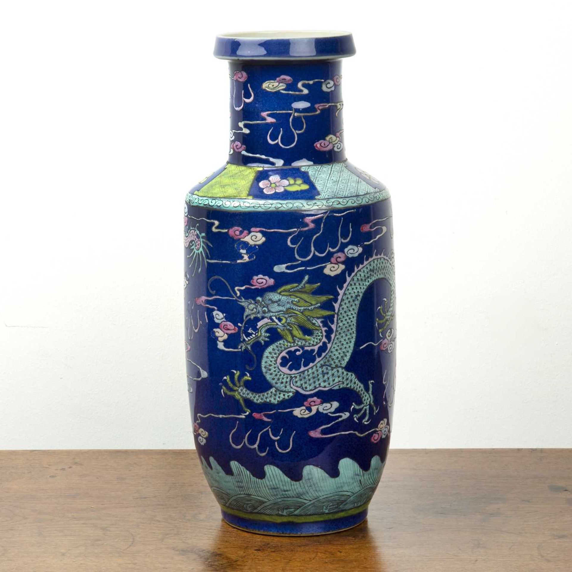 Blue ground rouleau vase Chinese, 19th/20th Century painted in enamels with dragons and flaming